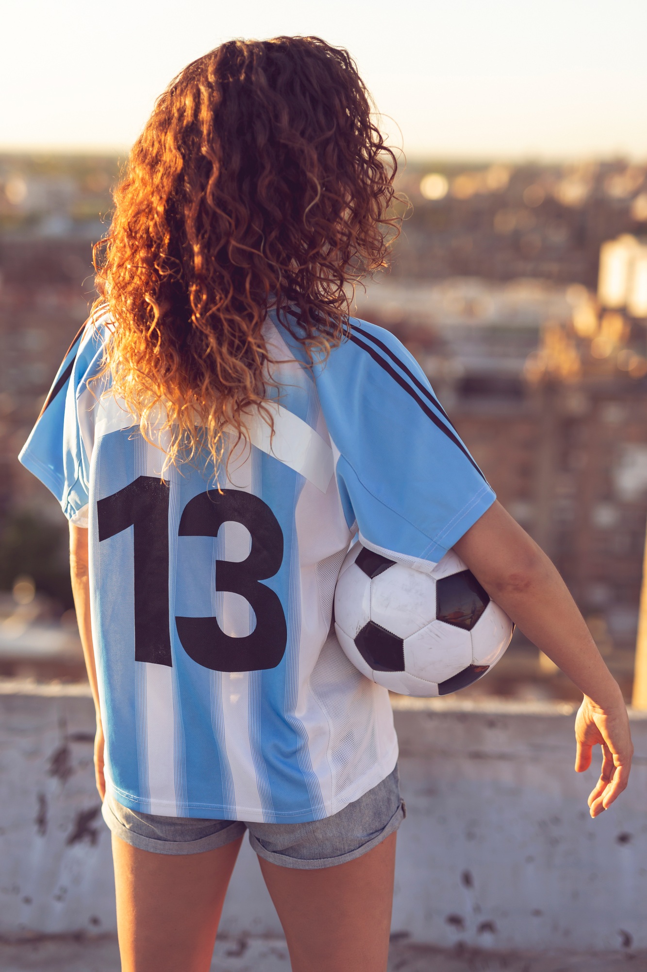 Woman in a football jersey